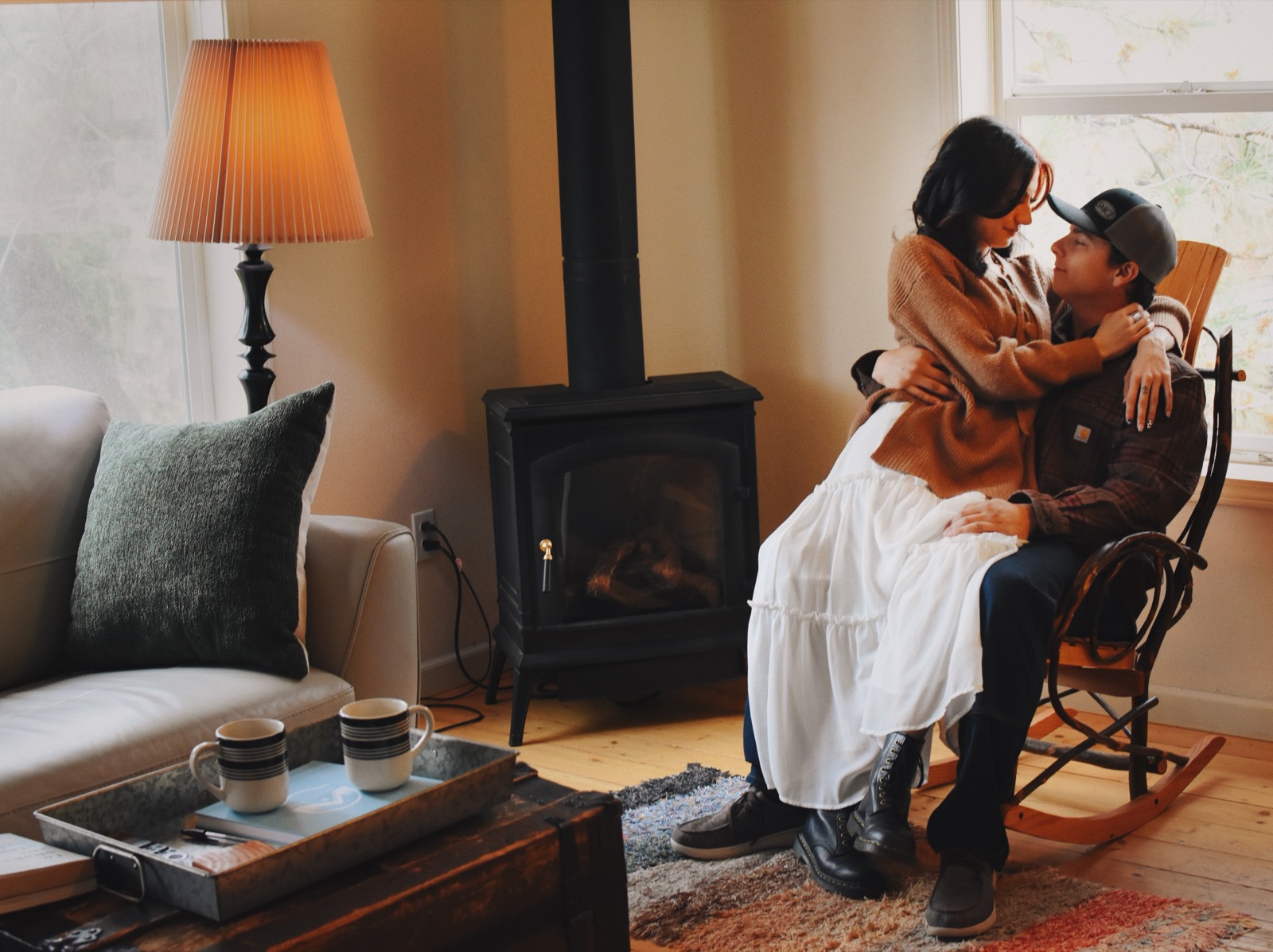 Couple by the fireplace at Brodie Cabin